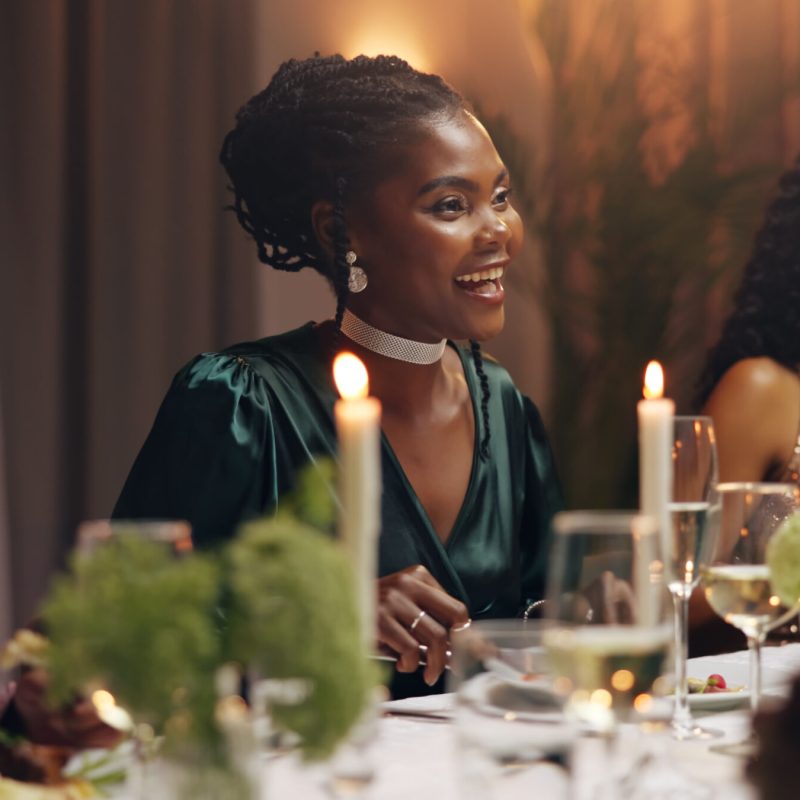 Women, dinner and business people at party with food, drinks and plate for charity drive at night. Group, friends and luxury fine dining for fundraiser with celebration, alcohol or talk at gala event.